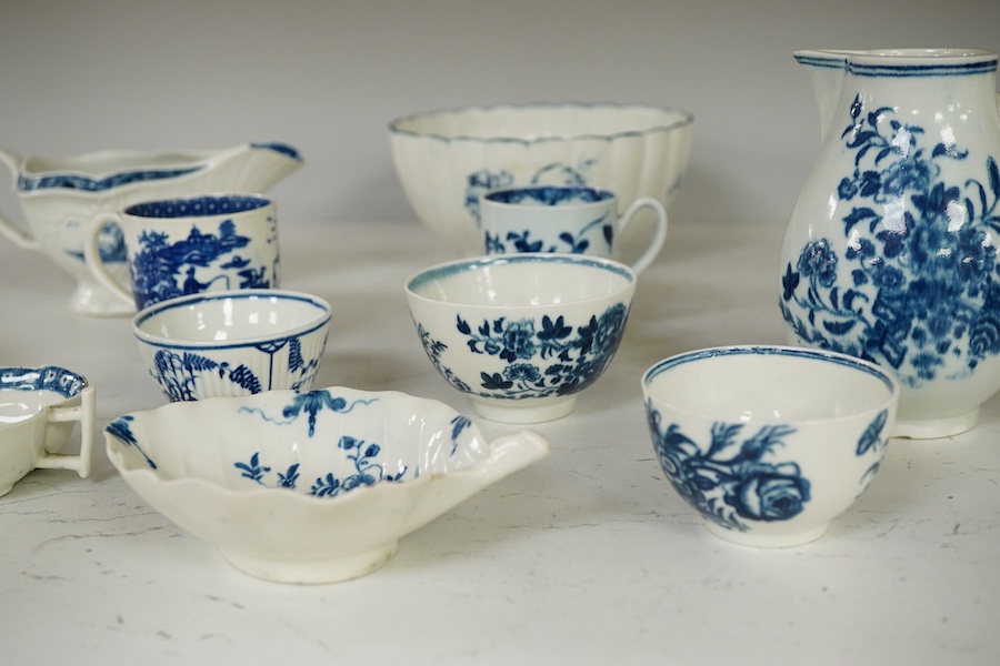 A collection of first period Worcester blue and white porcelain to include a Fence pattern sparrow-beak jug, a fluted Gilly-flower pattern bowl, a peony rock bird scallop shell pickle dish, a butter boat, a fisherman and